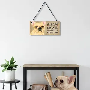 Decorative wooden plaque with French Bulldog print hanging in a cozy home setting