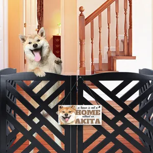 Akita wooden hanging sign "A house is not a home without an Akita" on a pet gate.