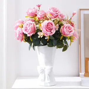 Artificial pink multi-head rose bouquet in elegant white bow vase for wedding home decor