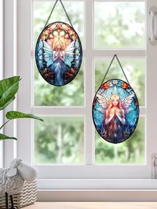 Detailed view of angel stained-glass acrylic hanging suncatchers on a window frame