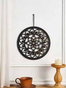 Bohemian wooden wall art detail, black hollow carved mandala hanging pendant for home decor.