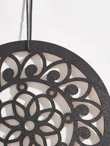 Boho wooden wall hanging detail shot, black carved round mandala decor for home decor.