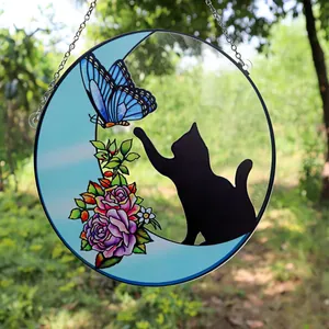 Decorative stained glass window hanging featuring a blue butterfly, cat silhouette, and moon