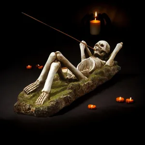Close-up of a realistic gothic skeleton incense holder featuring a mossy base ornament