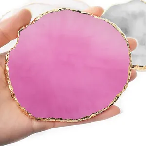 Detailed view of a pink resin palette featuring a gold rim and faux agate texture