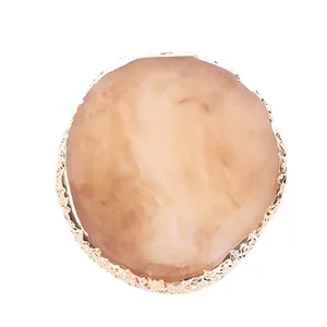 Faux agate resin nail art palette with textured gold trim and pink marble center