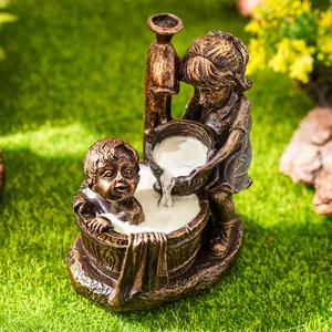 Close-up of vintage resin garden sculpture featuring children playing with water