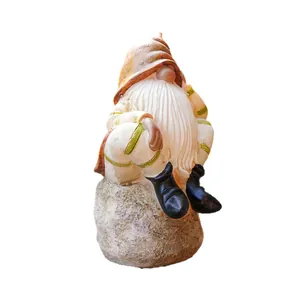 Hand-painted resin garden gnome figurine sitting on rock for home and desk decor