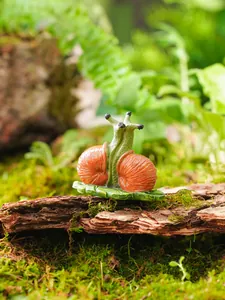 Detailed view of a charming resin cartoon snail statue for garden decoration