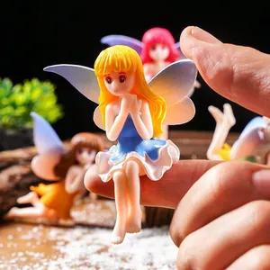 Miniature cute winged fairy figurine on finger for micro landscape and garden decor