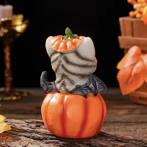 Detailed view of Halloween gray cat pumpkin resin ornament, perfect for desktop holiday decor.