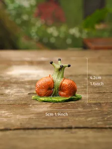 Detailed view of a cartoon resin snail ornament with dimensions for garden decor.