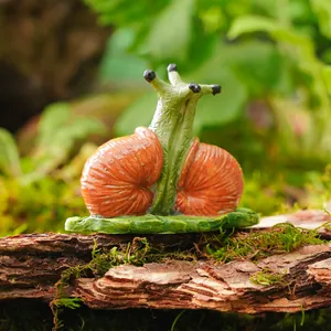 Detailed macro view of a unique resin double-shell snail garden ornament on bark.