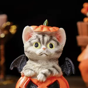 Close-up detail shot of the creative Halloween grey cat resin ornament with pumpkin and bat wings.