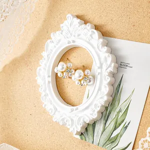 Detailed macro view of white vintage embossed frame used for decorative wall hanging