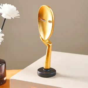 Modern golden abstract mask sculpture Silence is Golden resin home decoration detail view
