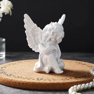 Elegant close-up of a white resin angel figurine statue for minimalist home decoration