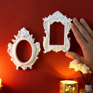 Vintage white European style embossed decorative wall hanging frames on a red background