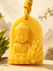 Detailweergave van geel Boeddha-gesneden aroma-waszakje met citrusgeur