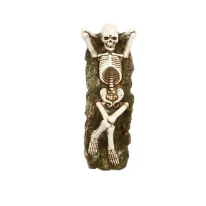 Vintage Gothic skeleton figurine lying on mossy base decorative desktop ornament