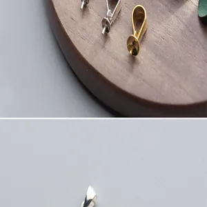 Detailed shot of S925 silver gold plated pendant bails and bead caps, perfect for handmade DIY jewelry.