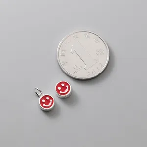 S925 silver red enamel smile face beads for DIY jewelry making shown with a scale coin