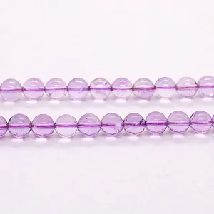 Macro close-up showing the translucent texture of natural lavender amethyst loose beads.