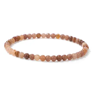 High-definition detail shot of 4mm polished natural sunstone beads on a delicate bracelet