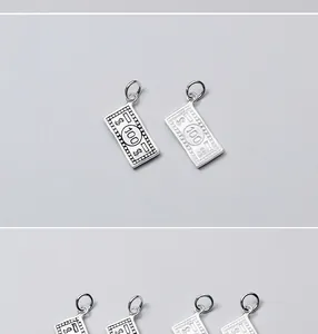 Detailed view of S925 sterling silver $100 bill charms for DIY jewelry making projects