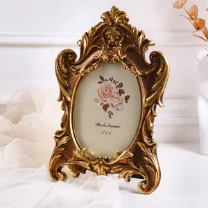 Ornate gold oval photo frame with classical European carving details for 4x6 pictures