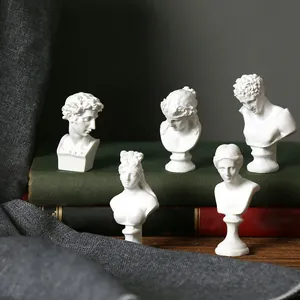 Detailed set of five miniature classical Greek myth bust sculptures on vintage books
