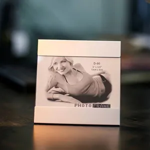 Detailed view of a minimalist metal and glass photo frame for stylish home decor