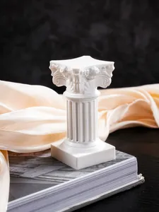 Close-up detail of a white Nordic style Roman column ornament with intricate resin carvings