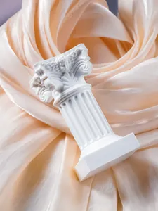 Close-up of a white Corinthian Roman column miniature prop for home desktop decoration