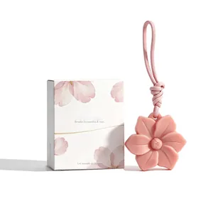 Elegant pink camellia-shaped hanging scented wax tablet with floral decorative gift box