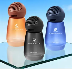 Matte auto-aromatherapie parfumflesjes in oranje zwart en blauw op reflecterend glas