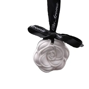 White camellia flower plaster aroma tablet with black ribbon hanger for home and car