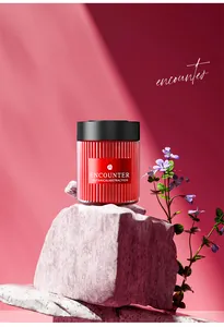 Close-up of red luxury car solid aroma diffuser on a stone with purple flowers