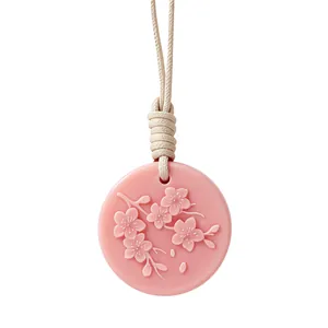 Pink aroma wax sachet featuring embossed cherry blossom pattern and beige hanging rope