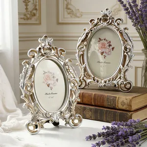Detail view of ornate vintage oval photo frames with exquisite carving on old books