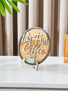Close-up of a circular wooden plaque with 'But First Coffee' slogan and rustic stand