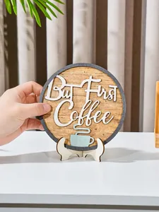 Close-up detail of wooden round decorative plaque with But First Coffee slogan and cup