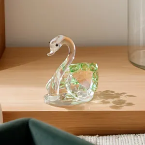 Elegant transparent faceted crystal swan figurine with green accents for luxury home decor
