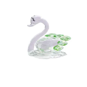 Elegant clear crystal swan figurine ornament with green faceted crystal wing accents