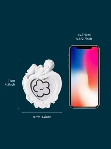 Dimensions of white angel resin photo frame compared to a smartphone for scale