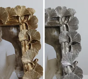 Detailed view of creative ginkgo leaf resin photo frames in gold and silver finishes