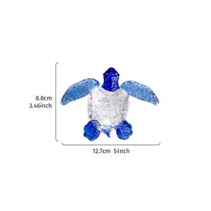 Detailed view of a clear blue crystal turtle ornament showing size dimensions in cm and inches.