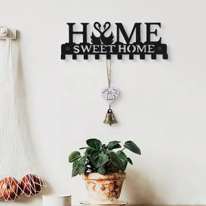 Decorative black iron Home Sweet Home wall-mounted key rack featuring a swan heart design