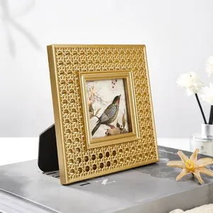 Detailed view of a European retro gold resin photo frame with rattan weave texture