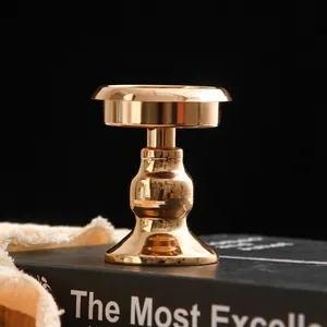 Detailed view of a French minimalist gold metal candle holder with a polished finish